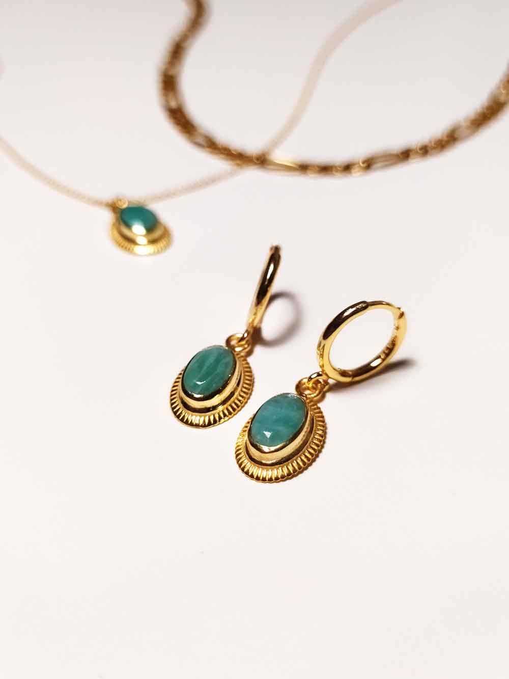 Earrings with amazonite stone. Gold jewelry.